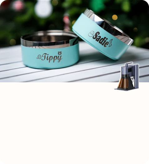 Custom engraved pet feeding bowls displayed in a soft outdoor setting.