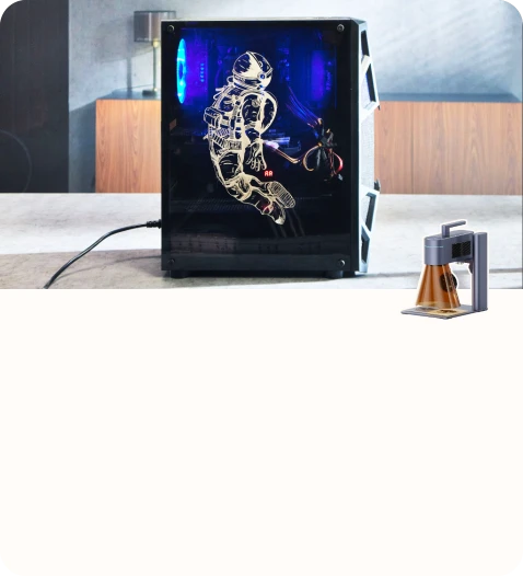 Desktop PC case engraved with astronaut artwork on the side panel.