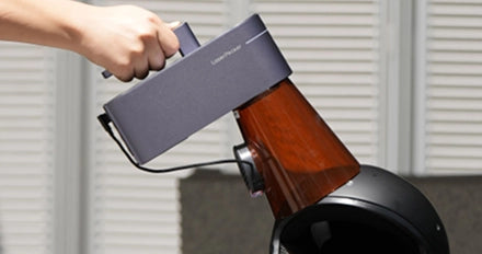 Handheld LaserPecker LP4 engraving at a unique angle on an irregular object.
