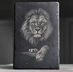 A majestic lion portrait laser engraved on a black stone slate plaque using LaserPecker LP4.