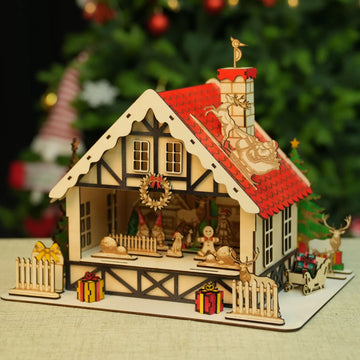 Laser cut wooden Christmas cabin from 3mm basswood plywood sheet.