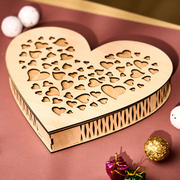Laser cut wooden heart-shaped box from 3mm basswood plywood sheet.